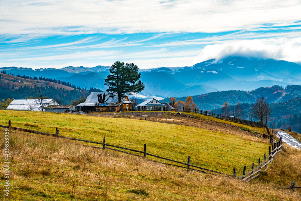 Beautiful forests covering the Carpathian mountains and a small village