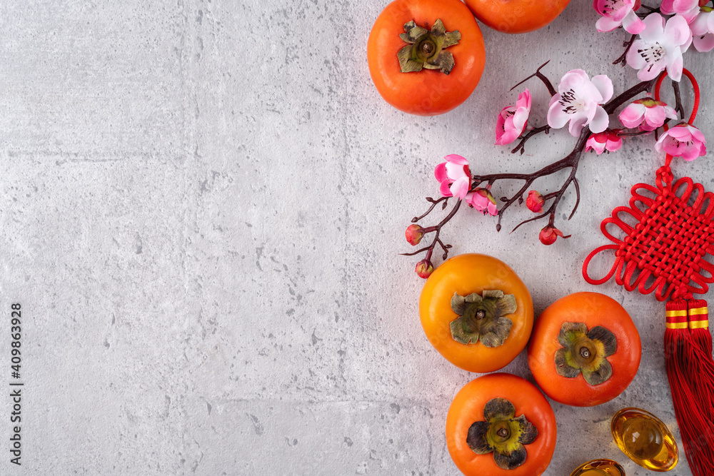 Top view of persimmons on gray table background for Chinese lunar new year