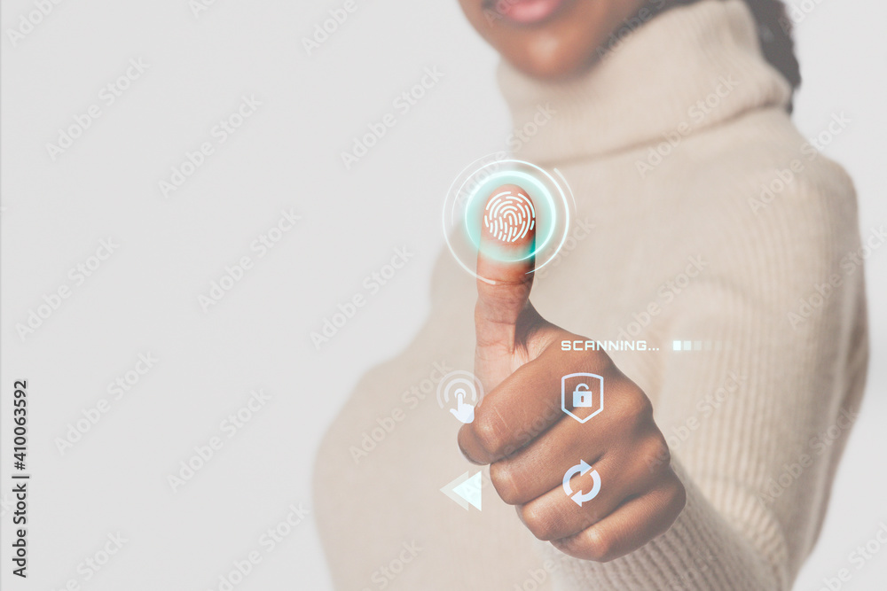 Woman scanning fingerprint with futuristic interface smart technology