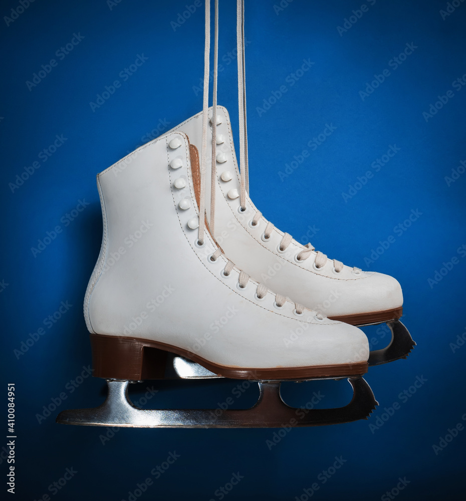 Womens figure skates on a white background. Still life. Close-up.