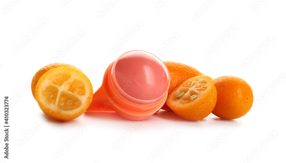 Natural lip balm with citrus fruit on white background