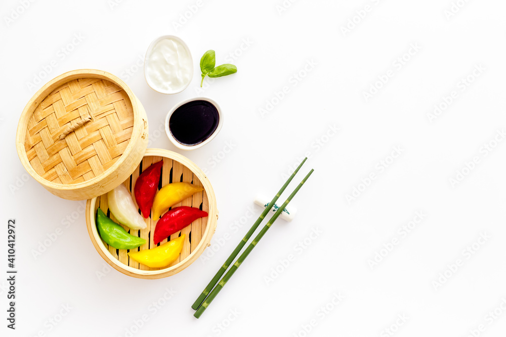 Asian steamed dumplings in wooden steamer. Traditional Chinese dim sum set