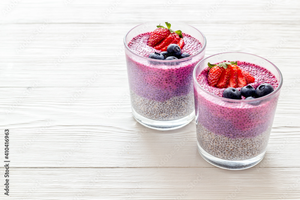 Homemade yogurt chia seeds pudding with strawberries in glasses