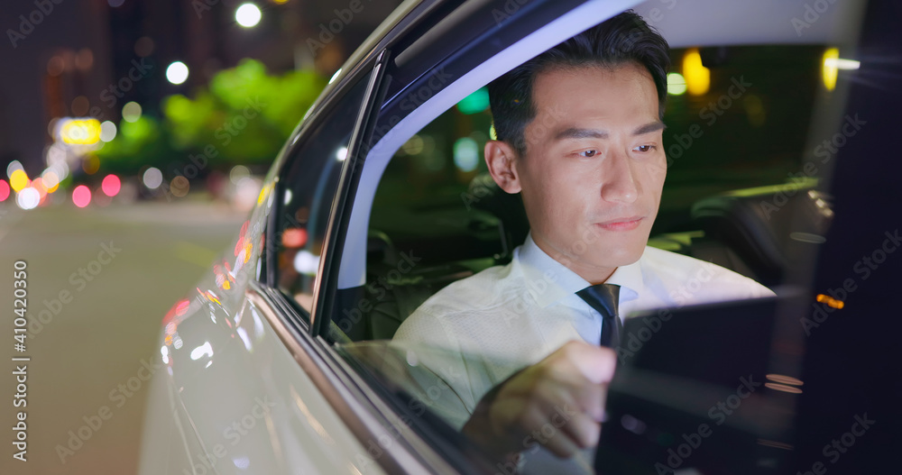 businessman use tablet in taxi