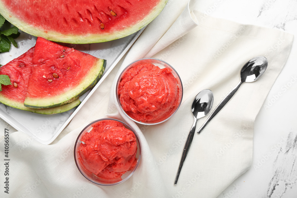 Glasses with watermelon ice cream on fabric background