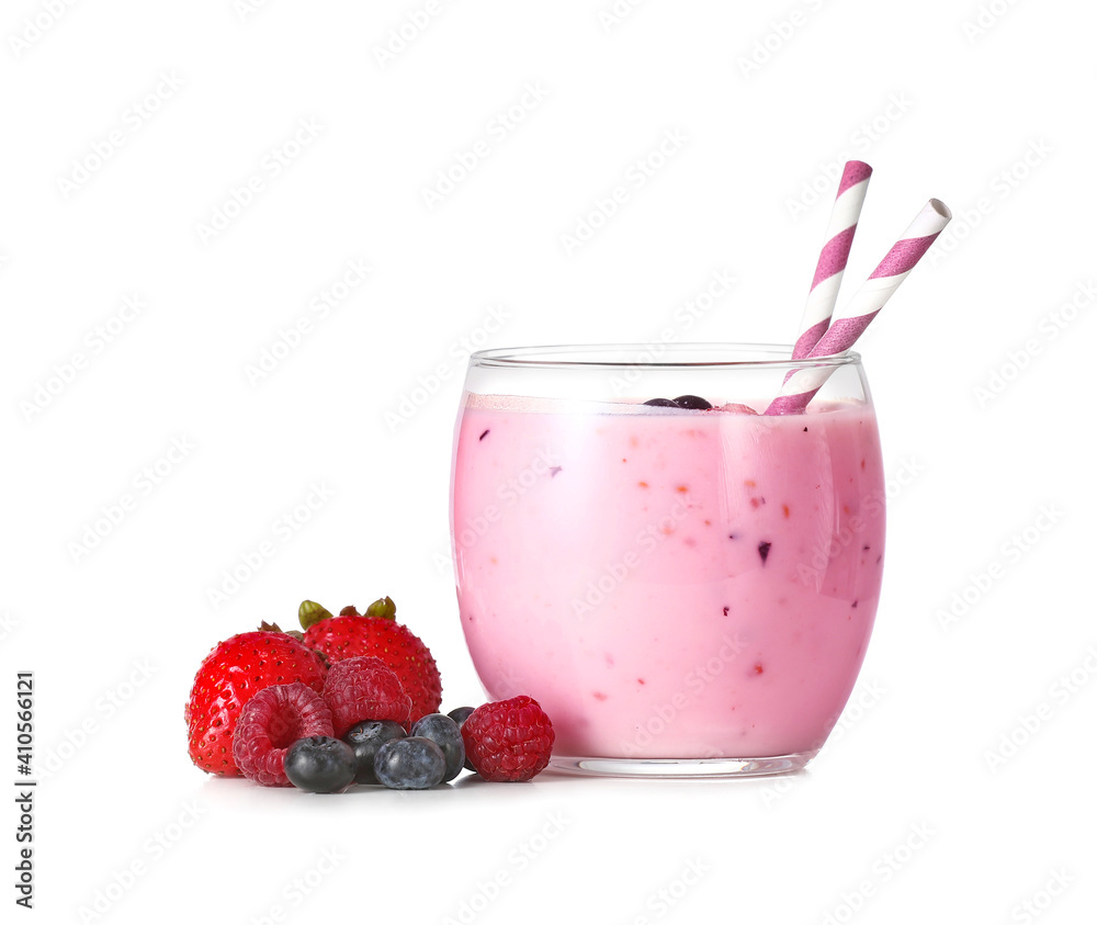 Glass of yummy smoothie with berries on white background