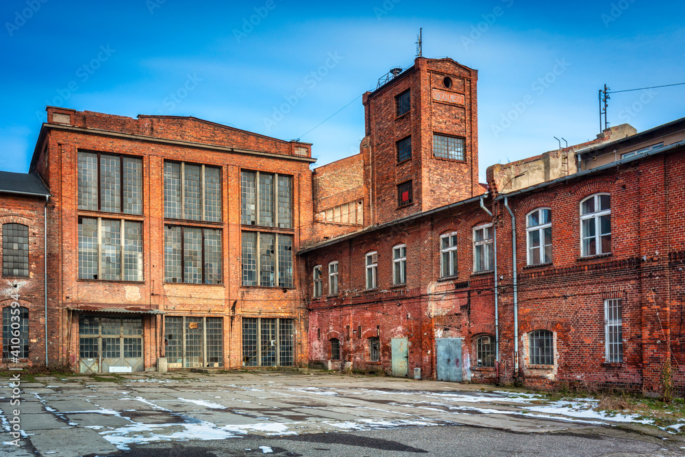 Ruins of a brick sugar factory in Pruszcz Gdański in winter, Poland