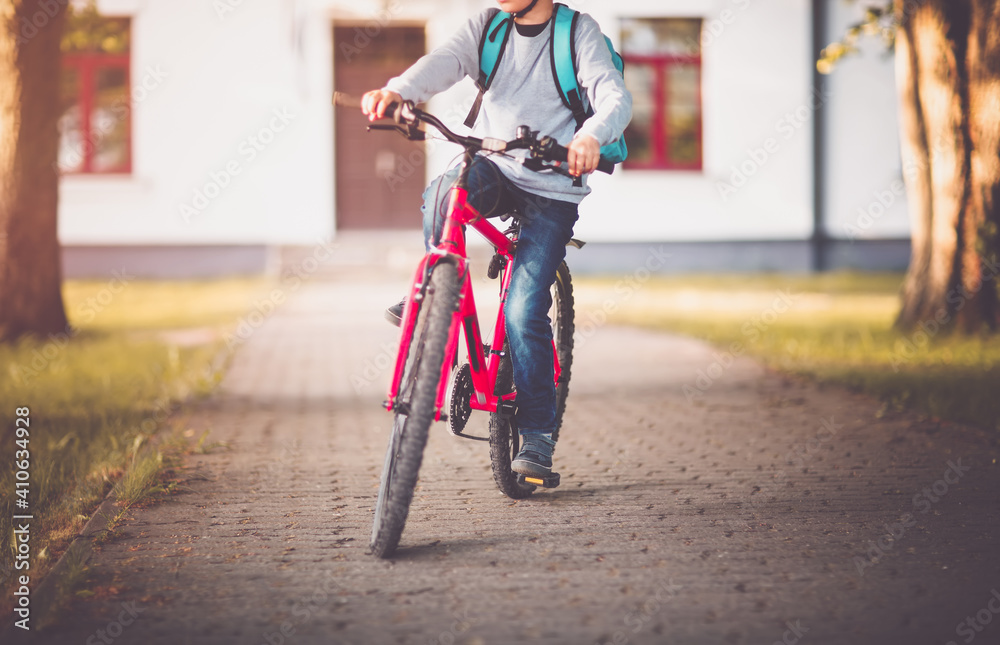 Child on a bicycle at asphalt road