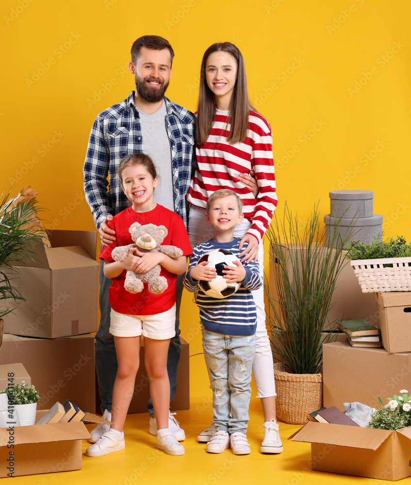 Content family with kids standing in new apartment