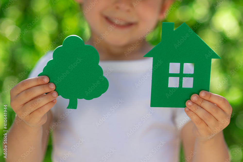 Eco house in children`s hands