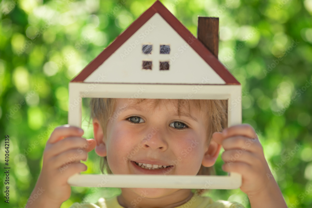 Eco house in children`s hands