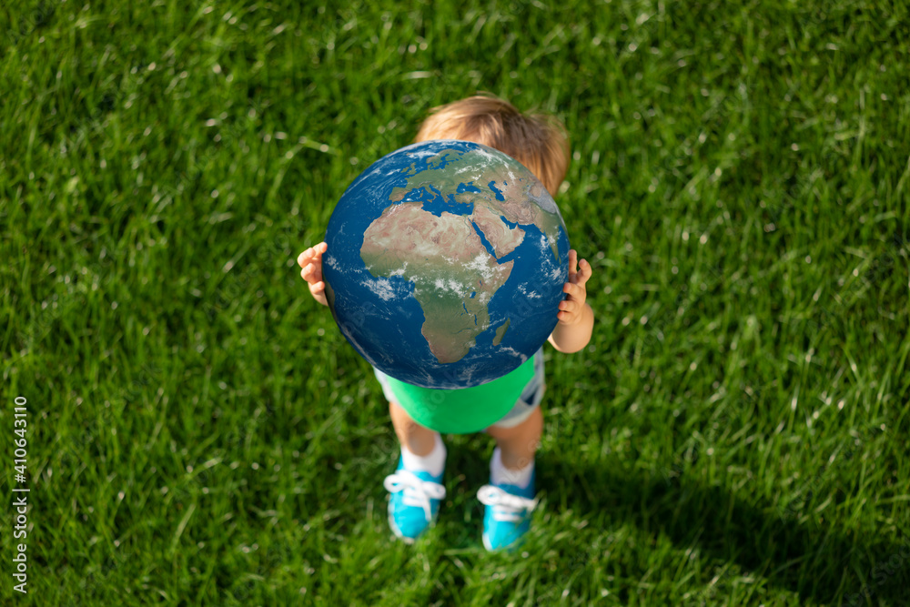 Child holding Earth planet in hands