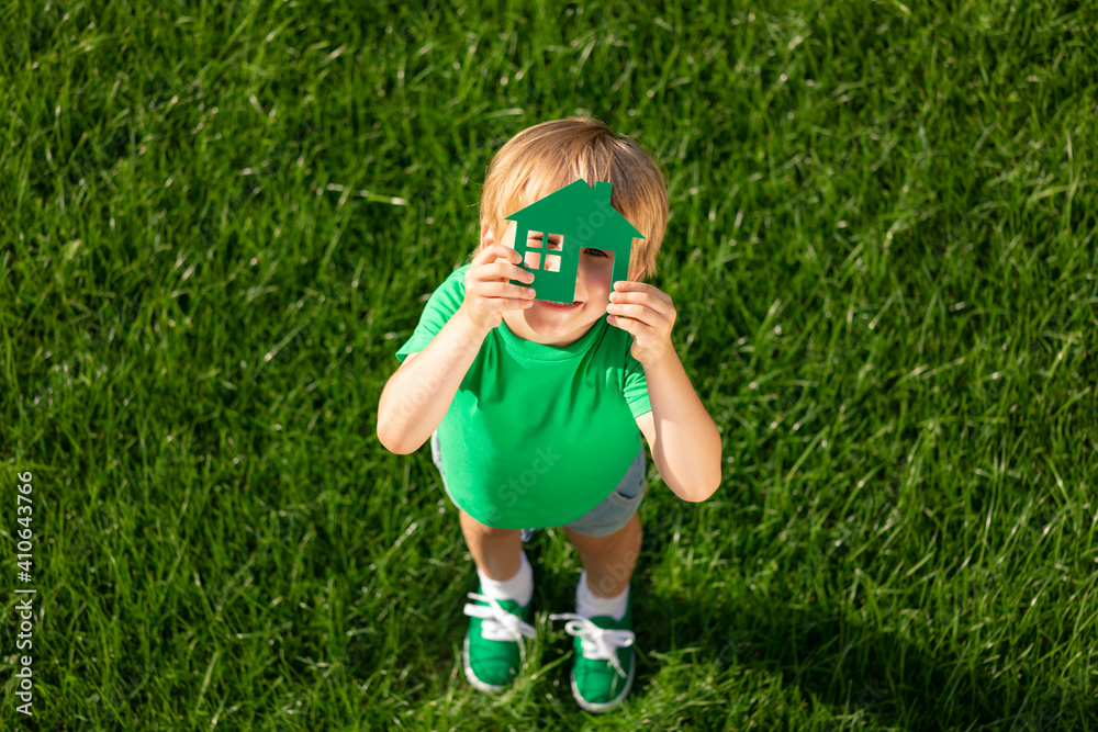 Eco house in children`s hands