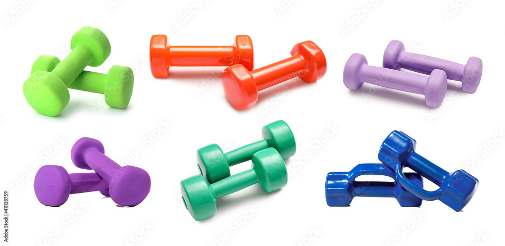 Set of dumbbells on white background