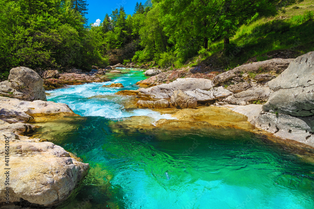 Emerald color Soca river with rocky shore, Bovec, Slovenia