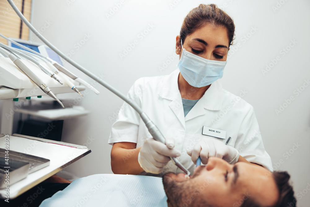 Dental doctor checking teeth of a patient