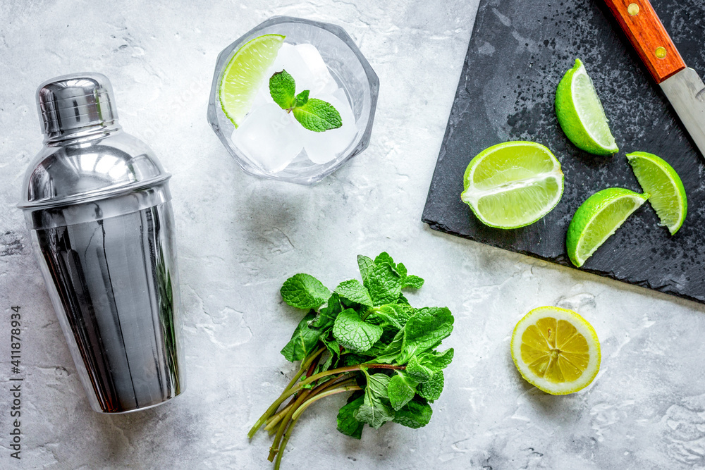 making mojito on stone background top view