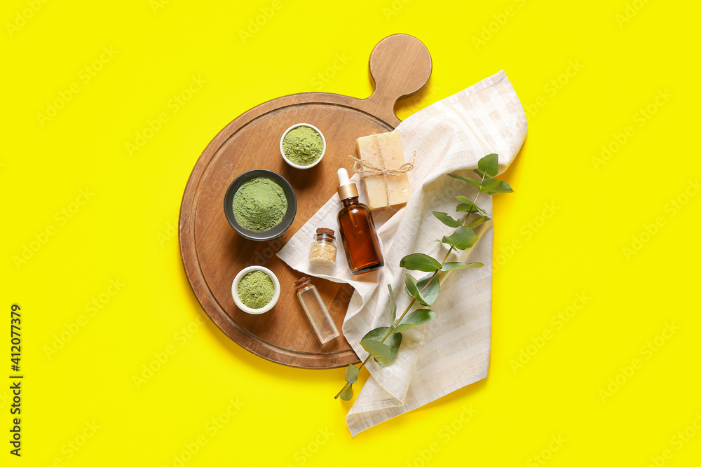 Henna powder with cosmetics on color background