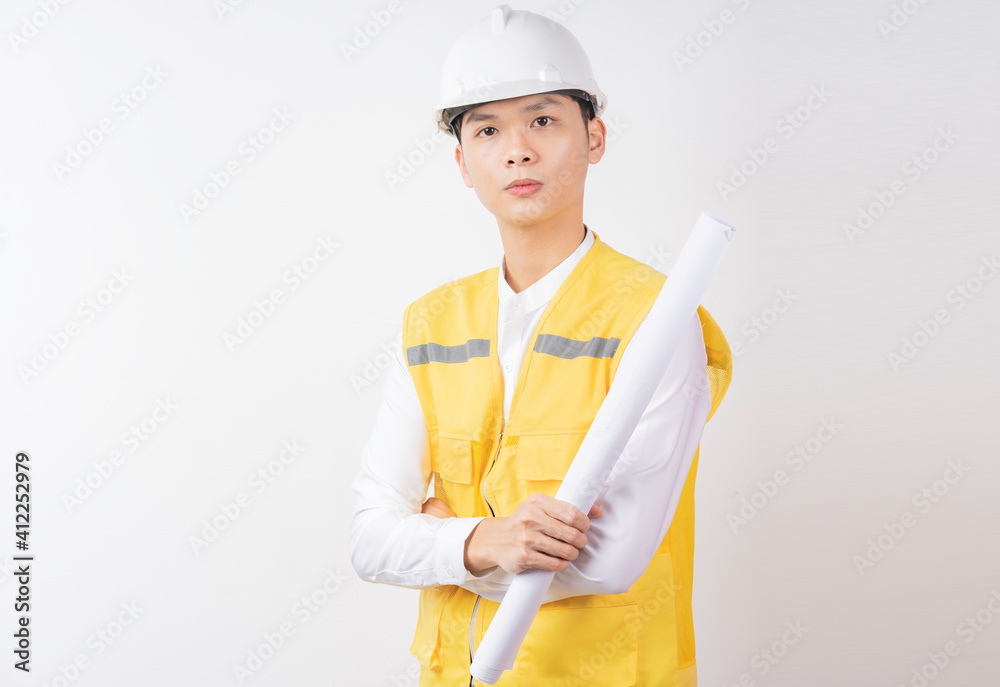 Portrait of male construction engineer with expression on white background