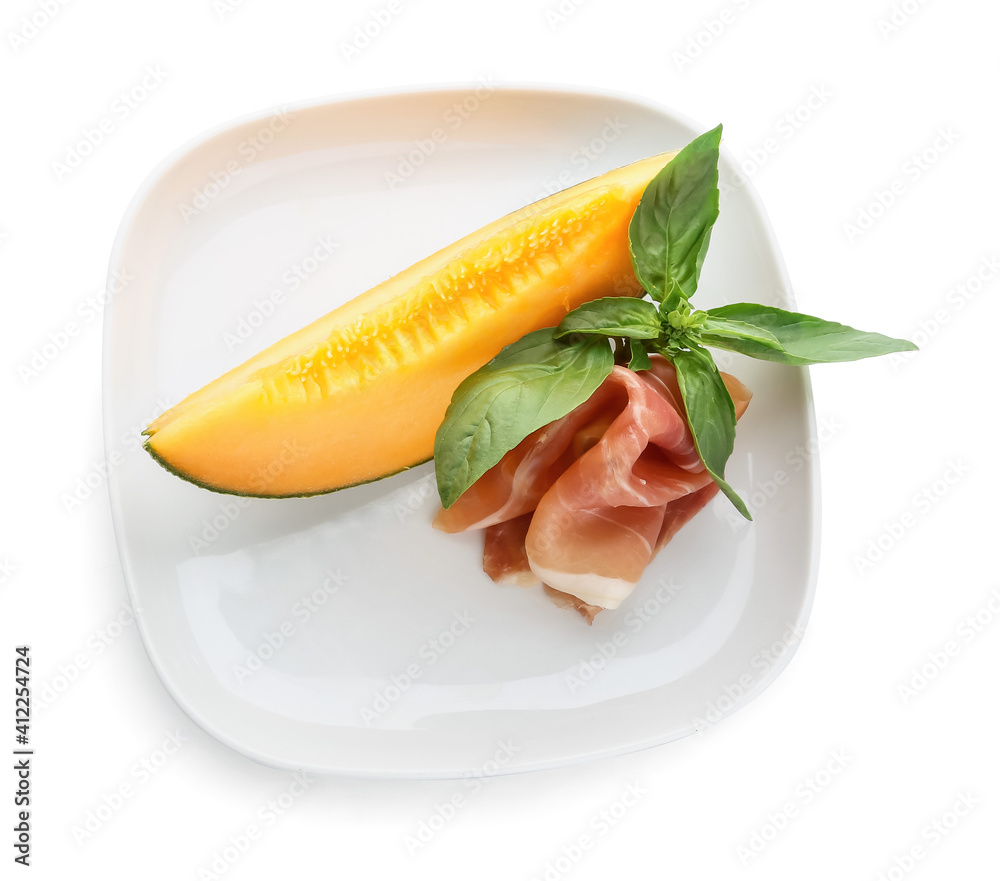 Plate with delicious melon and prosciutto on white background