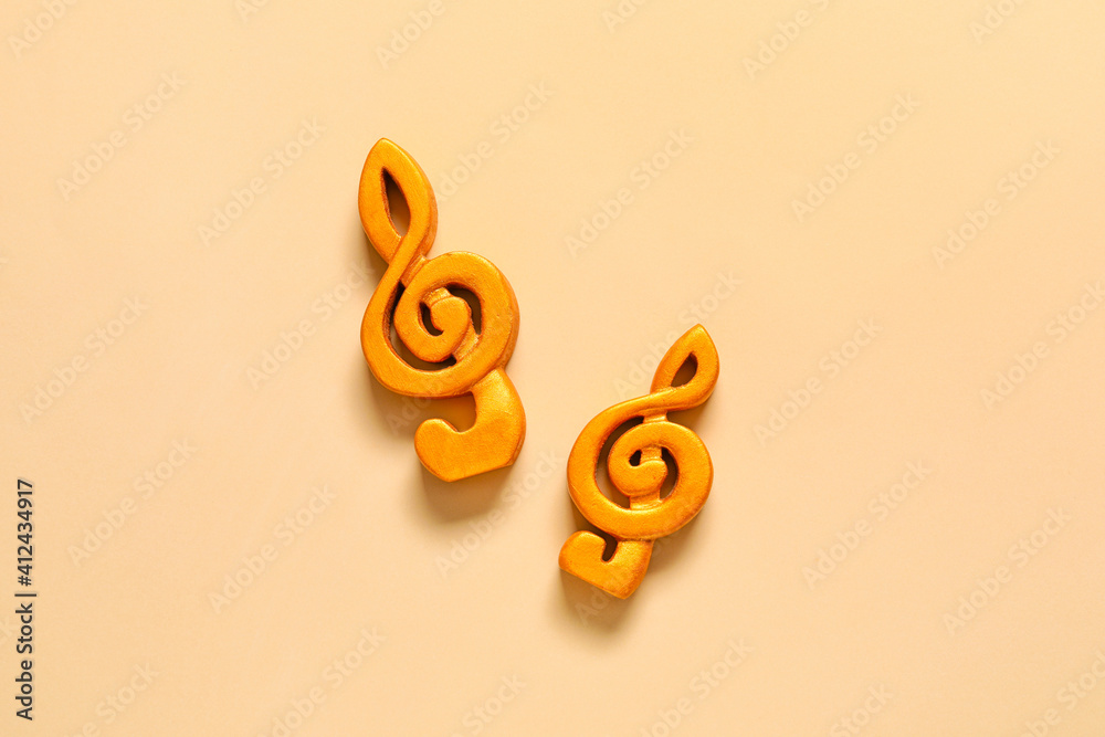 Violin clefs on color background