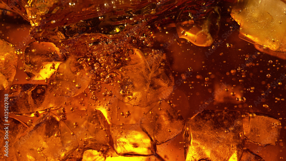 Detail of cola or alcoholic drink with ice cubes