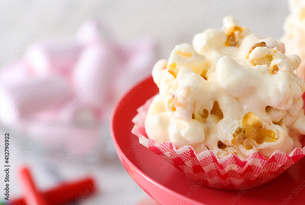 Tasty popcorn ball on dessert stand, closeup