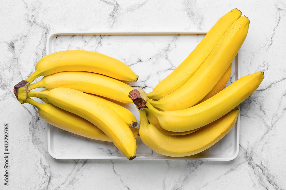 Tasty bananas on light background