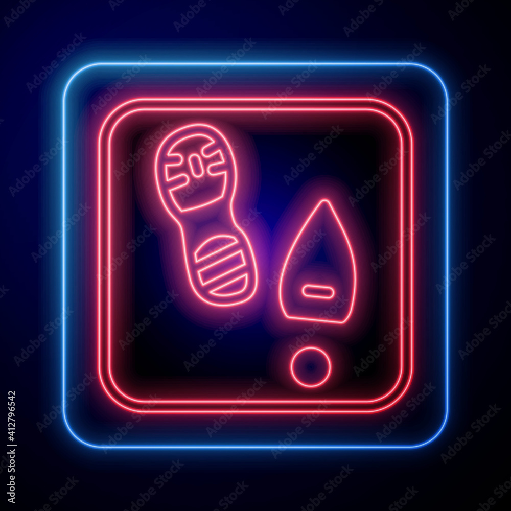 Glowing neon Human footprints shoes icon isolated on black background. Shoes sole. Vector.