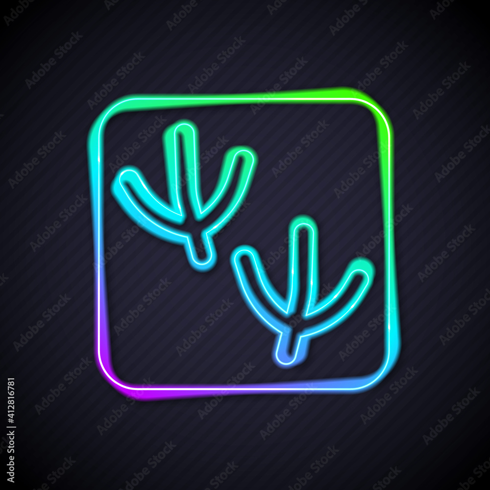 Glowing neon line Dove paw footprint icon isolated on black background. Vector.