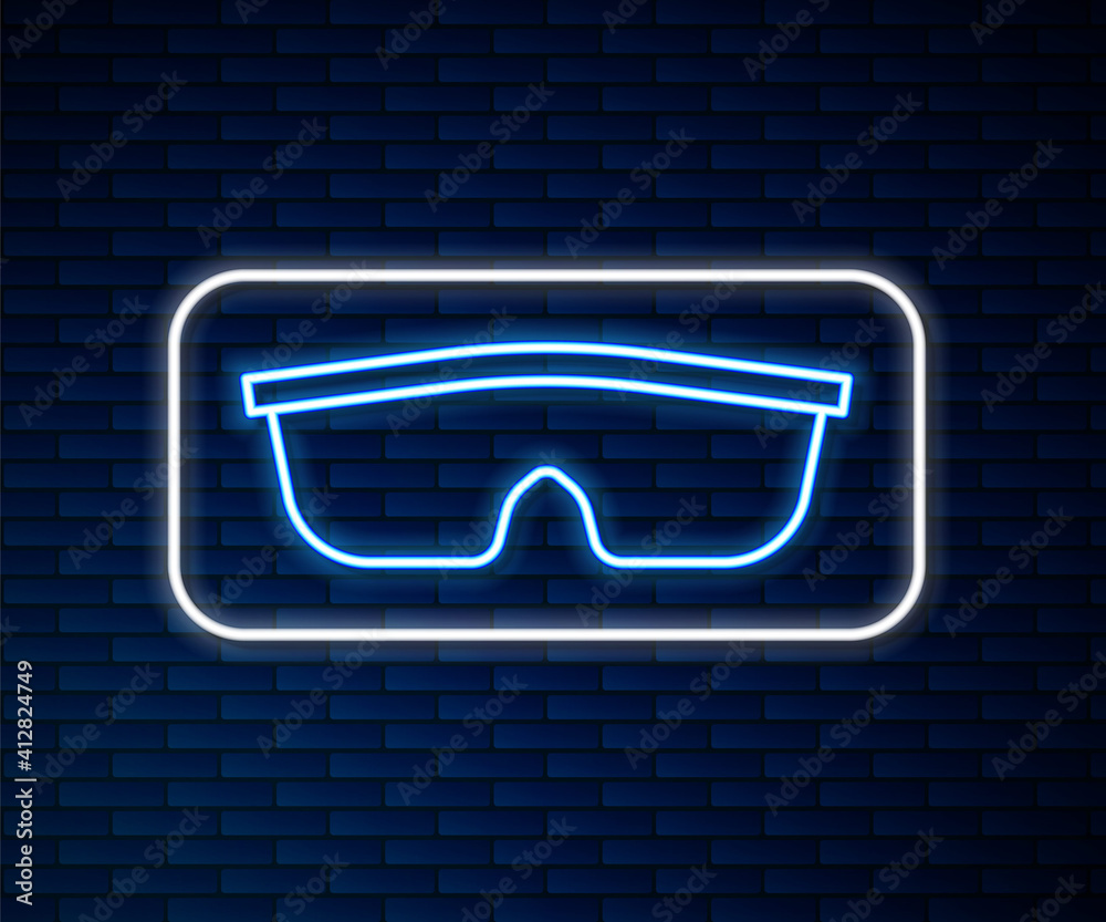 Glowing neon line Sport cycling sunglasses icon isolated on brick wall background. Sport glasses ico