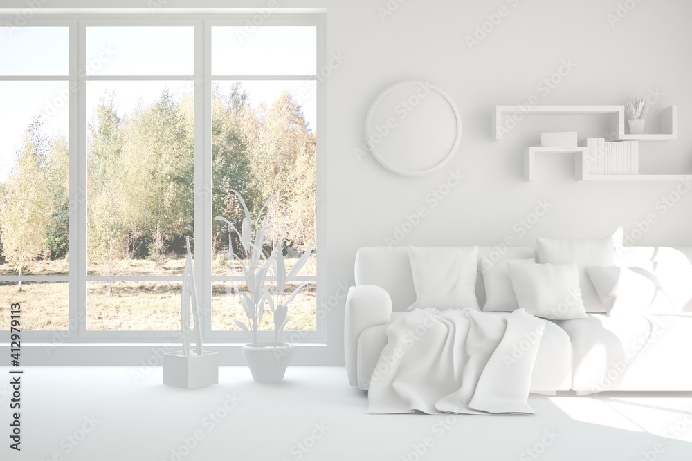 Stylish room in white color with sofa and autumn landscape in window. Scandinavian interior design. 