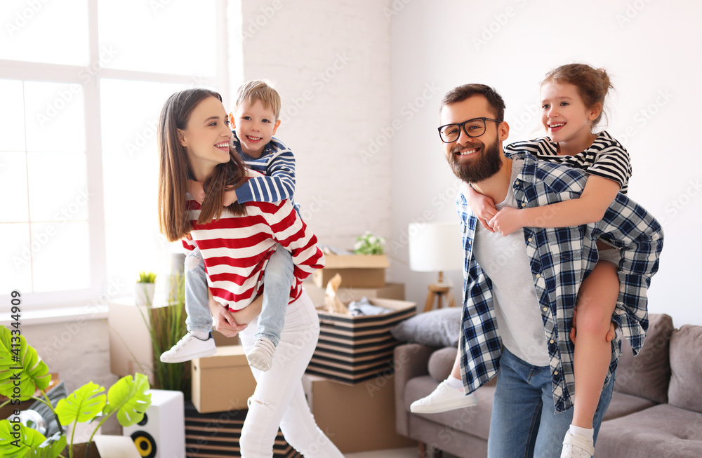 Cheerful parents carrying kids in new apartment