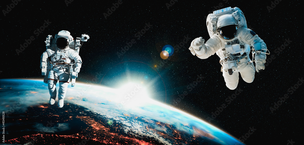 Astronaut spaceman do spacewalk while working for space station in outer space . Astronaut wear full