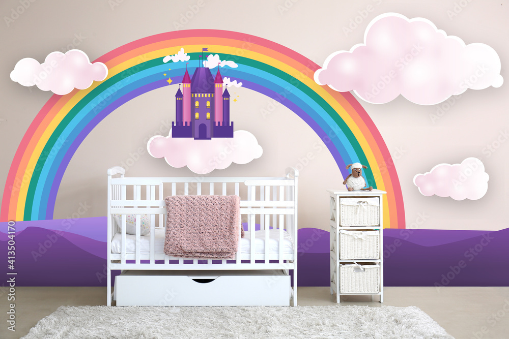 Interior of modern baby room with crib and painting of rainbow on wall