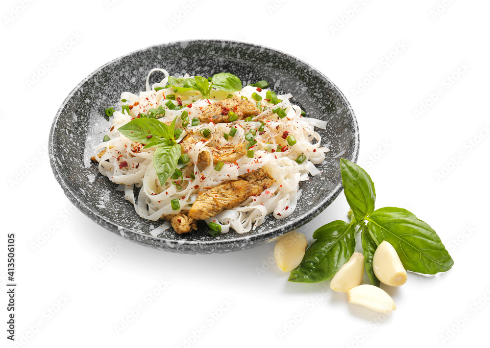 Plate with tasty noodles, chicken and garlic on white background