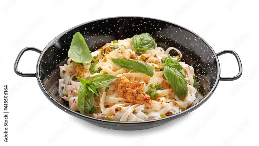 Frying pan with tasty noodles and chicken on white background