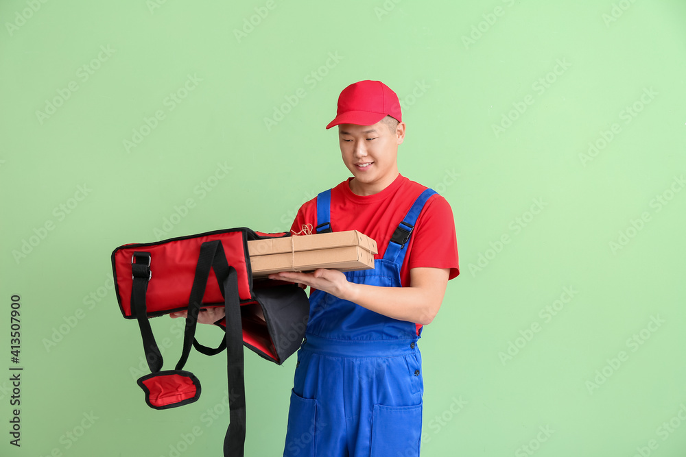 Courier of food delivery service on color background