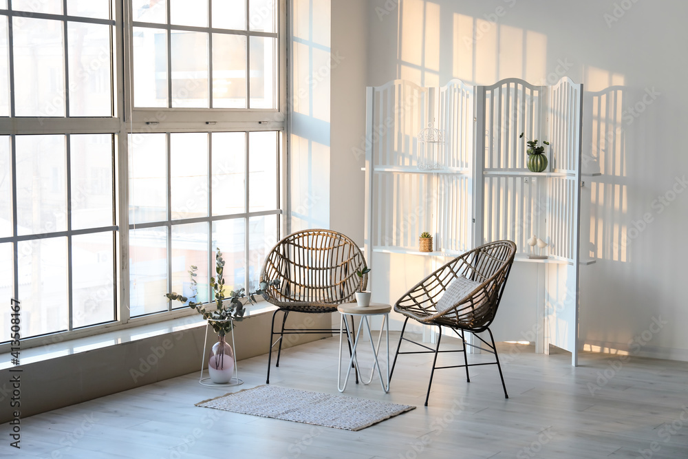 Wicker chairs in interior of modern living room