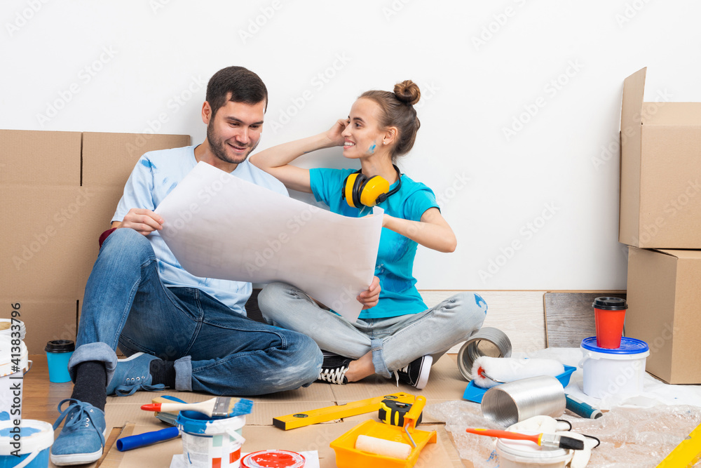 Young man and woman planning home renovation