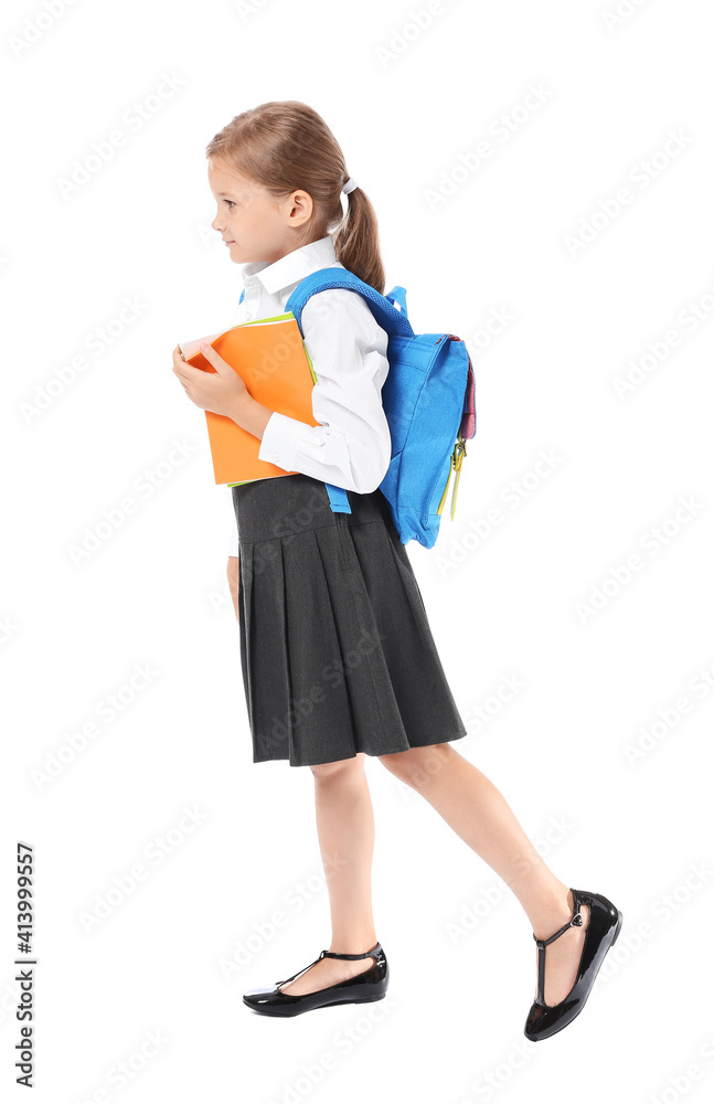 Little schoolgirl on white background