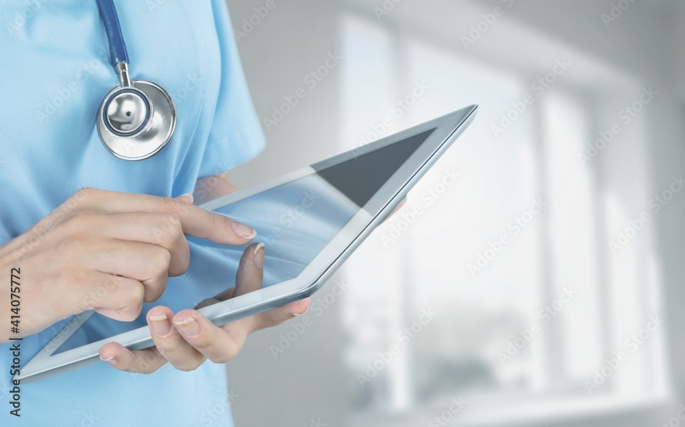 Close-up Doctor at hospital working with tablet pc