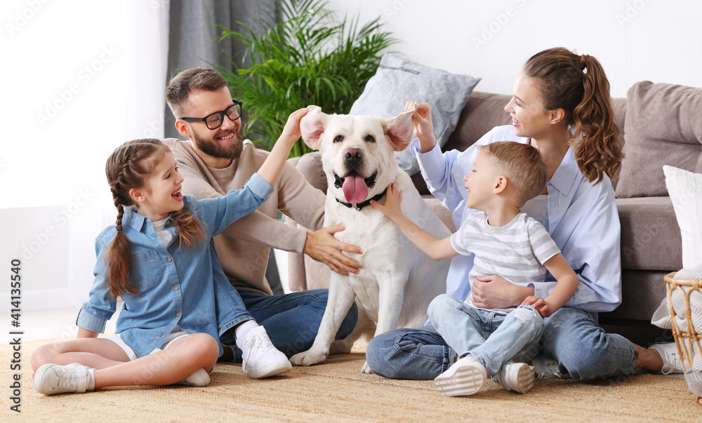 Positive family with kids and dog spending time together at home