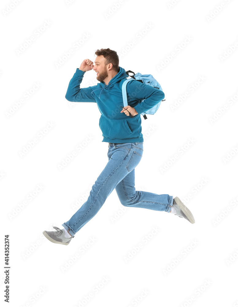 Jumping male student on white background