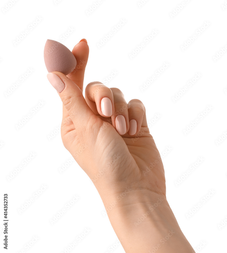 Hand with makeup sponge on white background