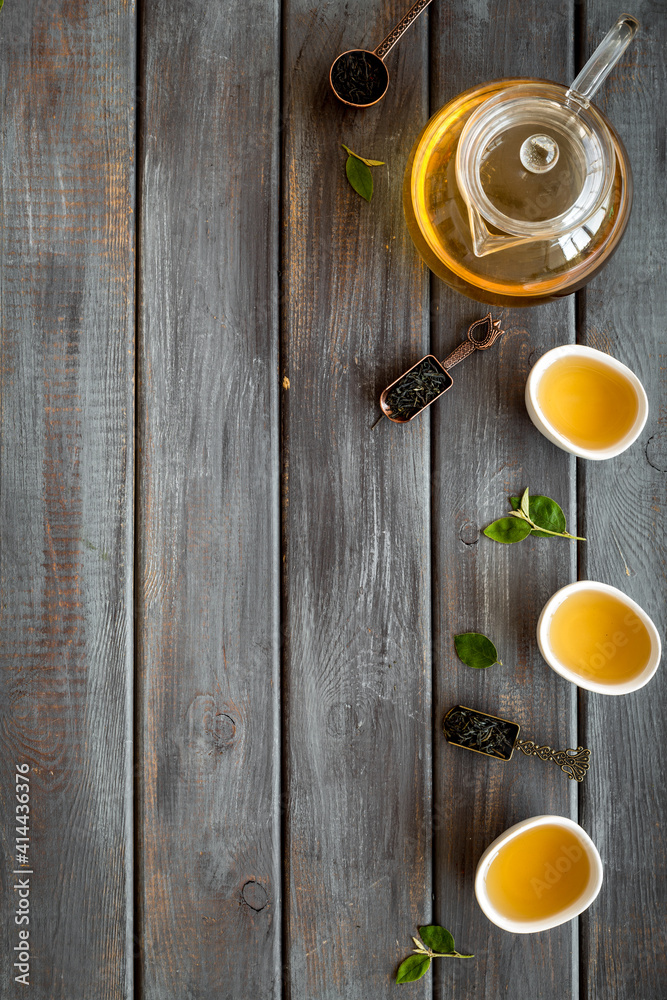 Asian tea ceremony with cups and teapot, top view