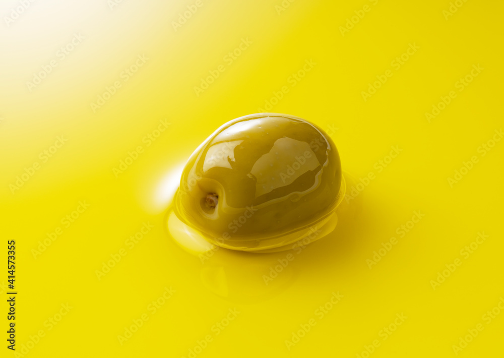 Olive fruit soaked in olive oil across the screen