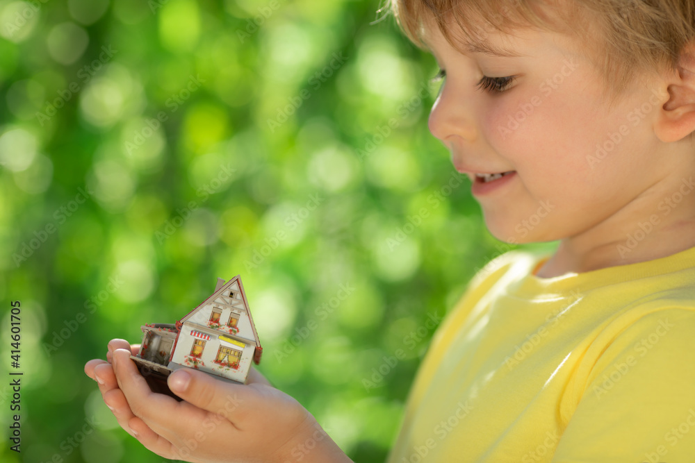 Eco house in children`s hands