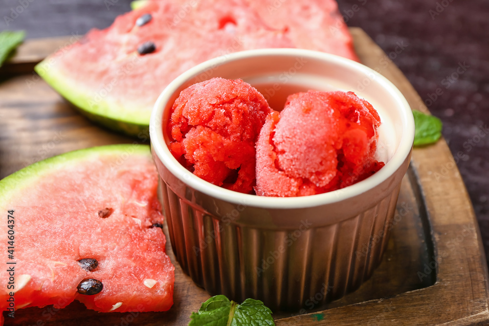 Bowl with watermelon ice cream on table, closeup