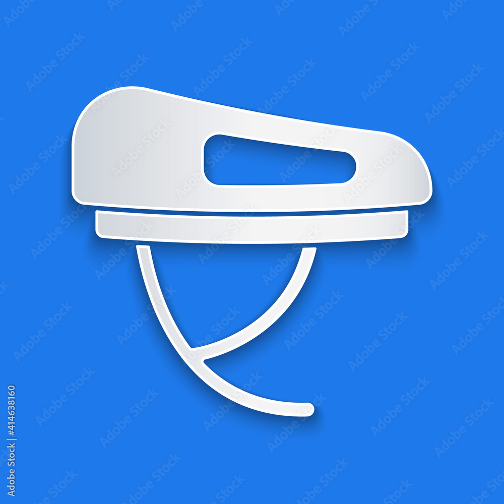 Paper cut Bicycle helmet icon isolated on blue background. Extreme sport. Sport equipment. Paper art